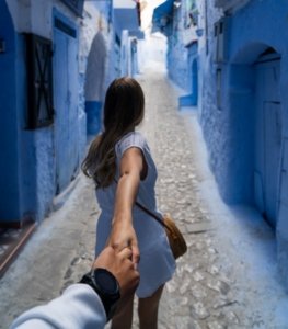 Woman exploring Chefchaouen during a day trip in the Blue City of Morocco