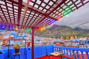 Traditional Moroccan rooftop restaurant in Chefchaouen during a day trip